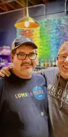 Nathan and Michael together in front of their bar